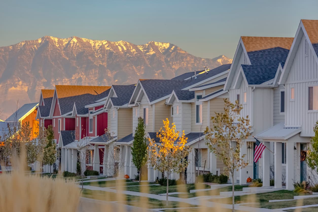 Street avenue with lined up homes on a sunset.